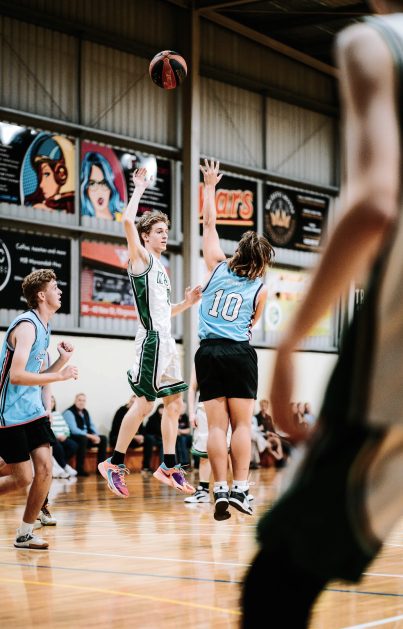 A player shooting over a defender